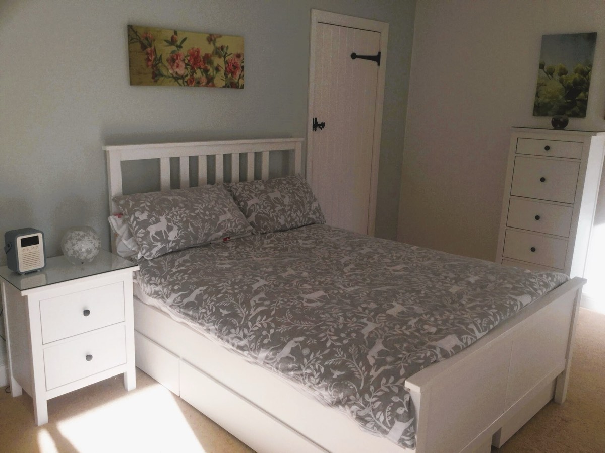A bright, simple bed and breakfast bedroom